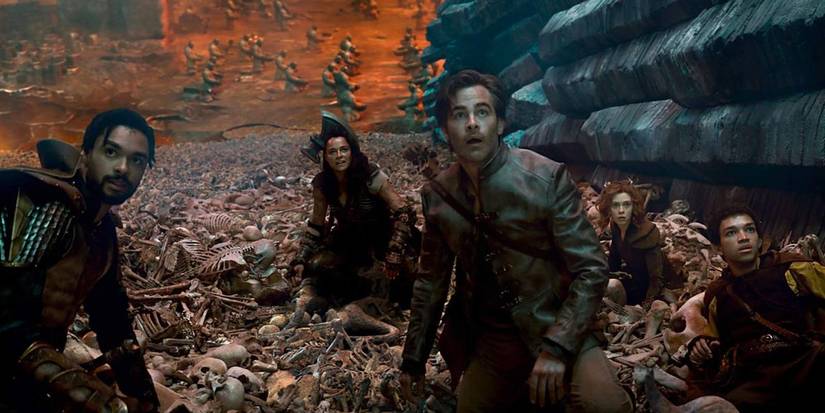 The cast of Dungeons & Dragons: Honor Among Thieves laying on bones. 