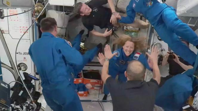In this image from video provided by NASA, France’s Sophie Adenot, Russia’s Andrei Fedyaev and Americans Jessica Meir and Jack Hathaway greet colleagues as they enter the International Space Station after arriving on a SpaceX Dragon capsule on Saturday, February 14, 2026. 