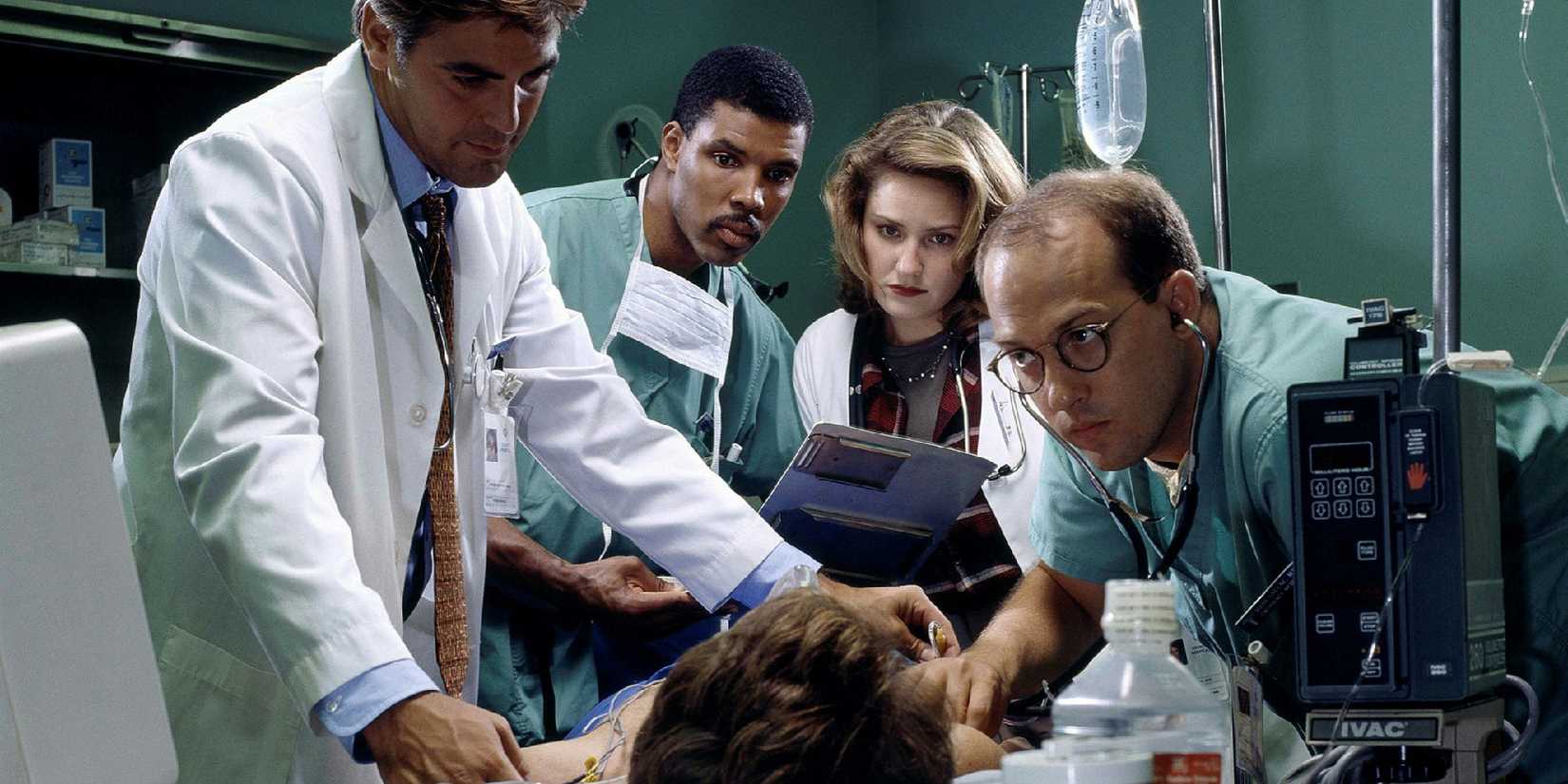 Several doctors gathered around a patient in ER