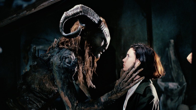 Doug Jones as the Faun grabbing Ivana Baquero as Ofelia in Pan's Labyrinth