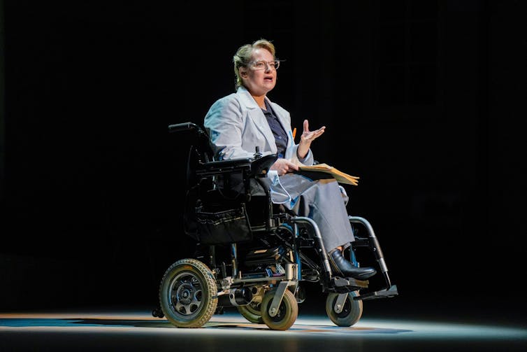 Production image: a woman in a wheelchair.