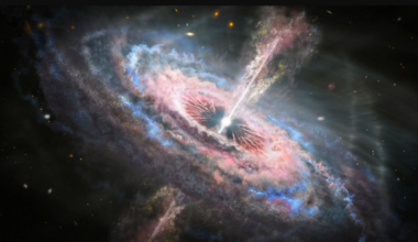 A giant swirling cloud of gas and dust in red and blue with a very bright center and jets.