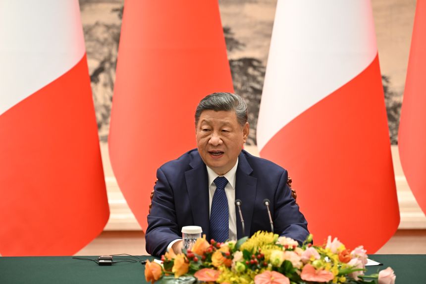 China's leader Xi Jinping speaks next to France's President Emmanuel Macron (unseen) during a joint press conference at the Great Hall of the People in Beijing, China on December 3, 2025.