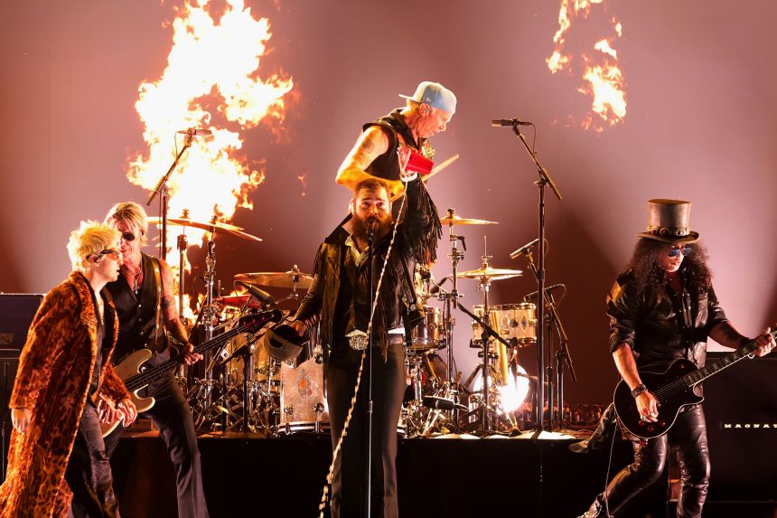(From left) Alex Watt, Duff McKagan, Post Malone, Chad Smith and Slash performing at the Grammys in Los Angeles on Sunday.