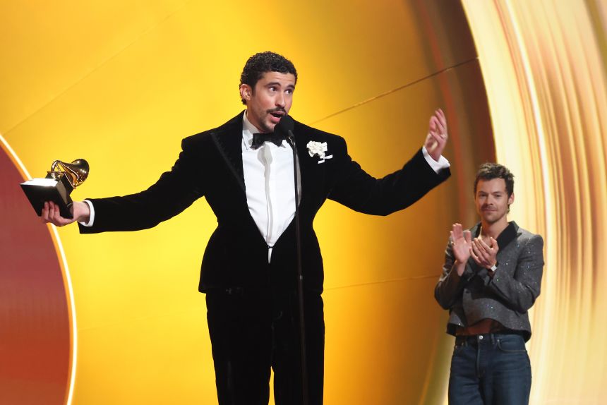 Bad Bunny accepts the album of the year Grammy at the end of the award ceremony in Los Angeles on Sunday night. It is the first time a Spanish-language album has claimed the Recording Academy’s top prize.