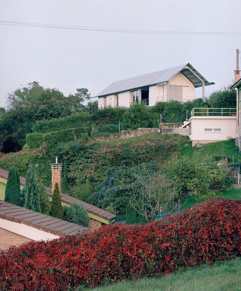 HANGHAR assembles steel-framed prefab residence in 48 hours on sloped spanish plot