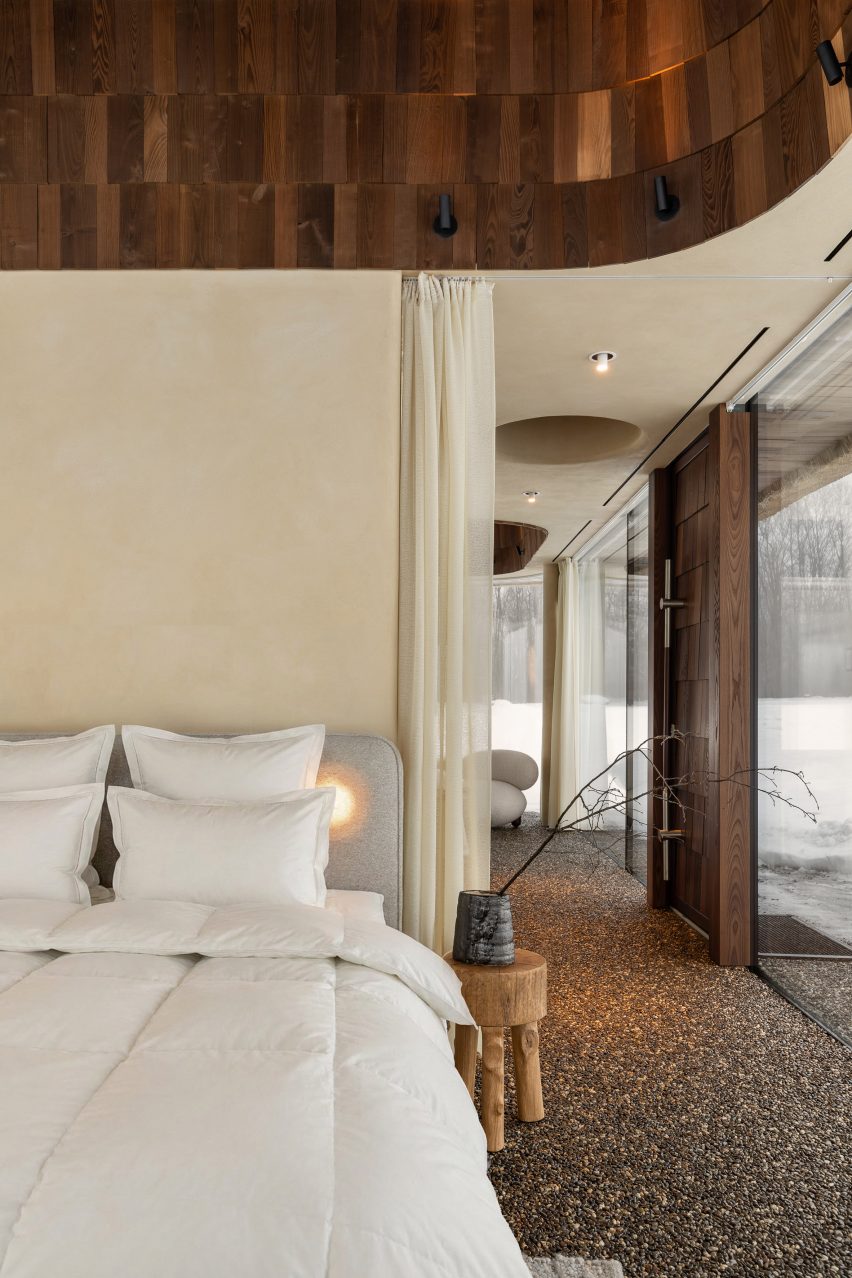 Neutral interior inside glass-walled hut