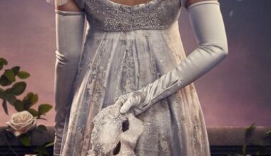 woman in a dress holding a mask