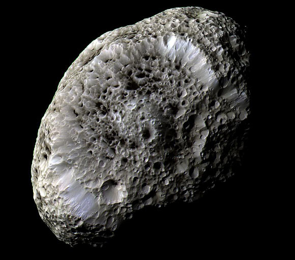 Cassini passed Hyperion on 31 May 2015 at a distance of about 21,000 miles (34,000 km). Mission scientists expect images from the encounter to arrive on Earth within 1-2 days. This view of the moon was obtained during Cassini’s flyby on 26 September 2005. It reveals crisp details across the strange, tumbling moon’s surface. Differences in color could represent differences in the composition of surface materials. Image credit: NASA / JPL-Caltech / Space Science Institute.