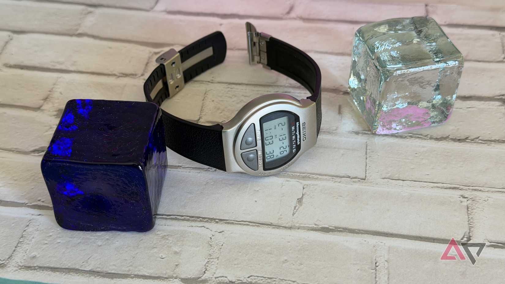 Seiko MessageWatch sitting next to glass blocks