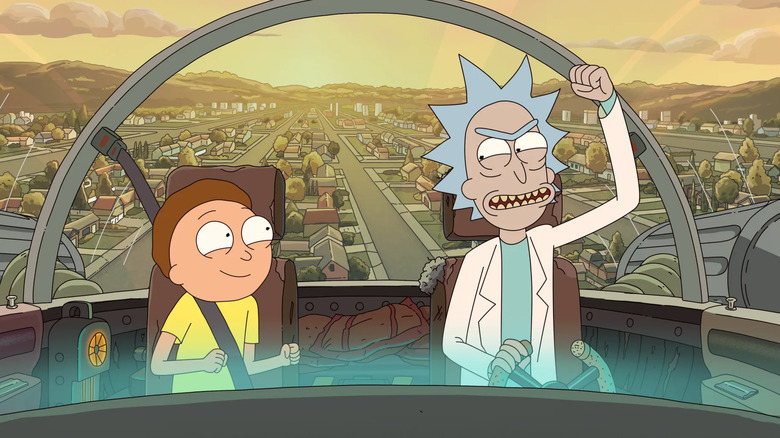 An excited Rick and Morty flying away in Rick's car.
