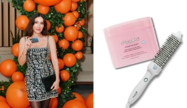 hair stylist jen atkin posing at a capital one event, holding the company's venture x business credit card; a mane hair mask and hot brush overlaid on a white background