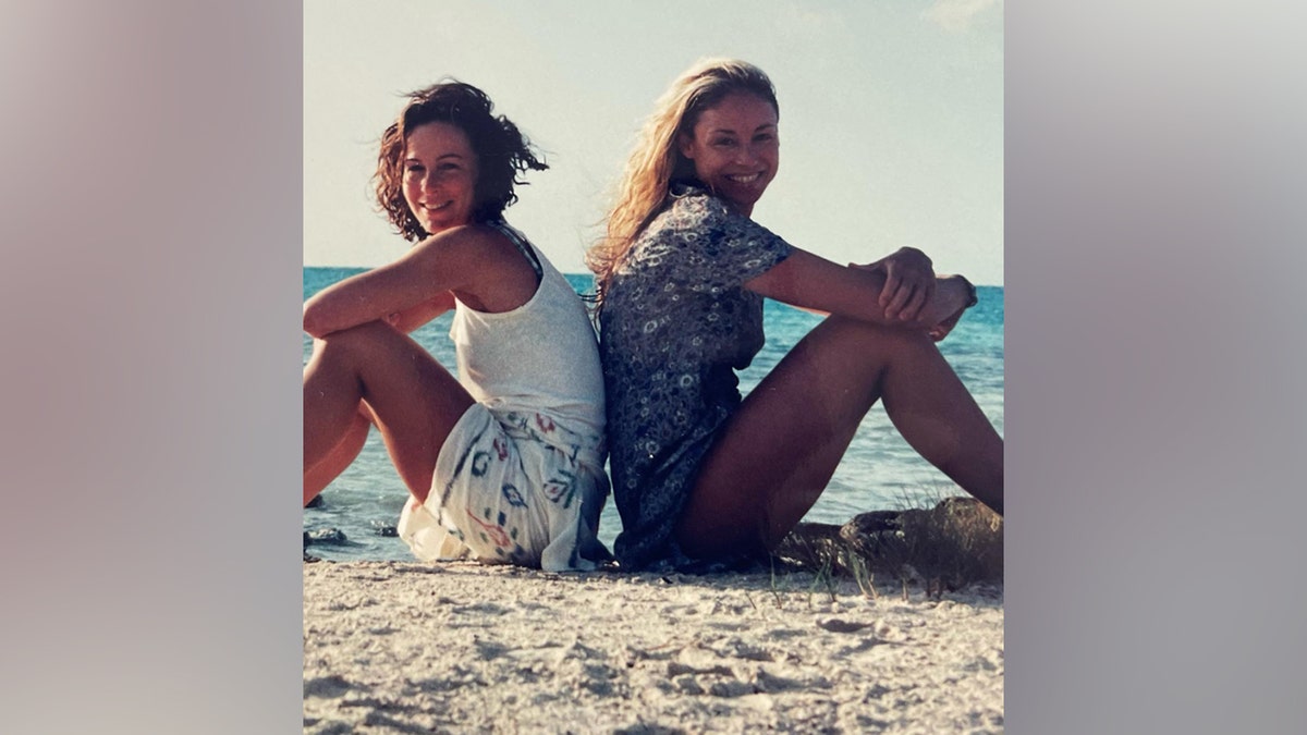 Jennifer Grey and Tracy Pollan pose together on a beach back then.