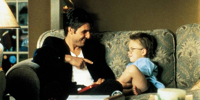 Tom Cruise and Jonathan Lipnicki laughing in Jerry Maguire