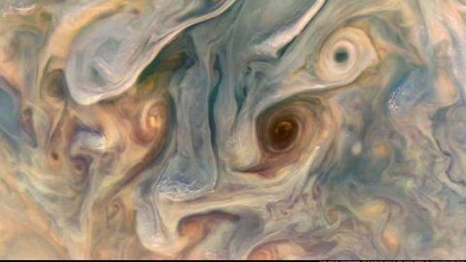 An enhanced Juno spacecraft image taken in July 2022 showing vortices and cloud "pop ups" in the Jovian atmosphere.