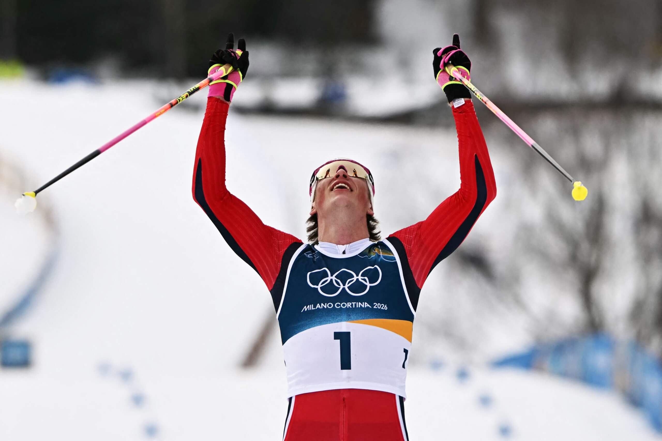 Norway's Johannes Hoesflot Klaebo celebrates as he crosses the finish line to win gold in the men's cross country 50km mass start final on Saturday.