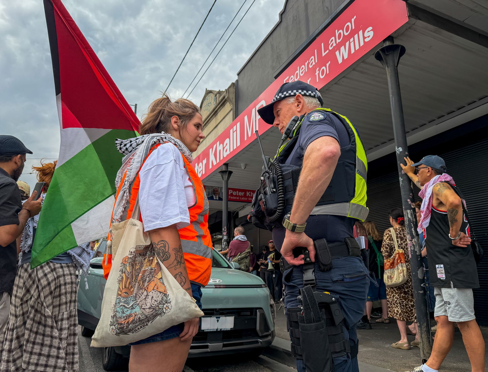 A protester speaking with a police officer