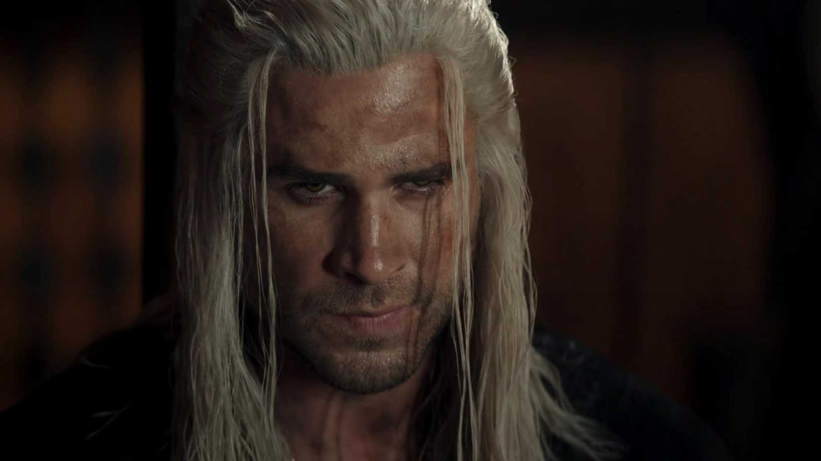 Liam Hemsworth as Geralt of Rivia looking at someone off screen in The Witcher season 4