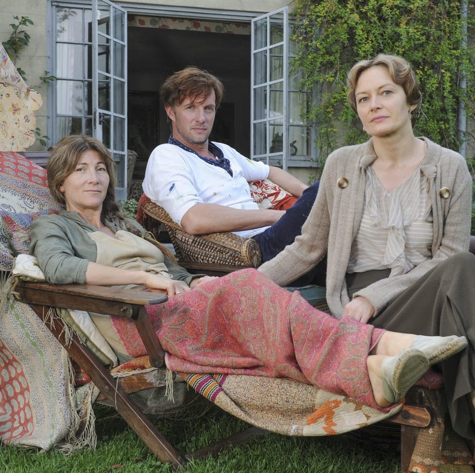 people relaxing outdoors in a garden setting