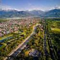 Aerial drone view panorama of big Almaty river and houses with scenery of snow mountains at background in Almaty city, Kazakhstan. Image © Pikoso.kz via Shutterstock London’s Brutalist Heritage and Australia’s New City: This Week’s Review - Image 2 of 12