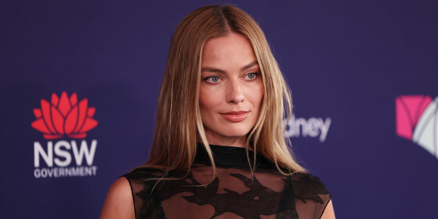 Margot Robbie Goes Full Goth With Only a Sheer Layer of Black Fabric Over Bra