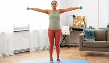 woman does lateral shoulder raise exercise at home