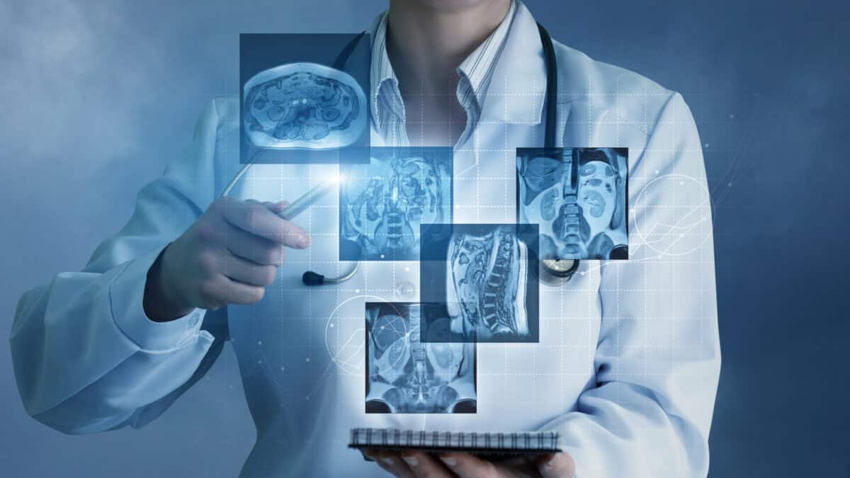 Doctor sees virtual images of the patient's x-rays on a blue background.