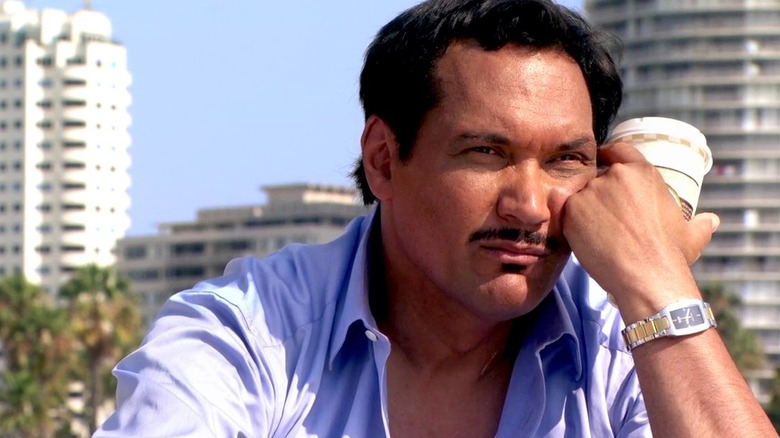 Jimmy Smits as Miguel Prado, holding a coffee cup on Dexter.