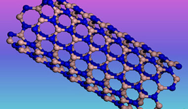a rainbow background with a ball-and-stick diagram of a rolled sheet of boron nitride.