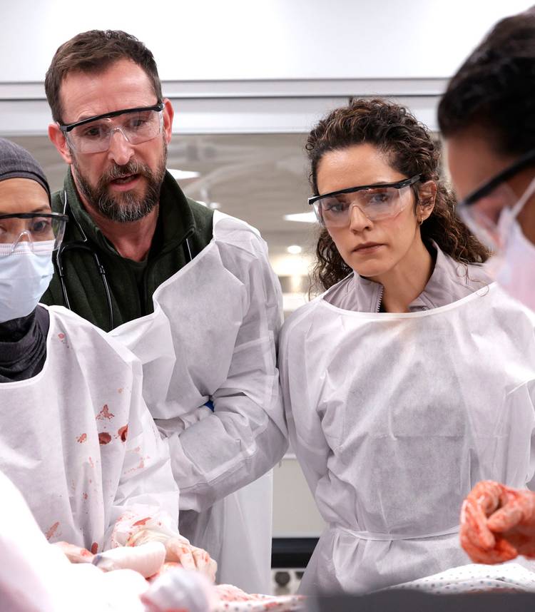 Noah Wyle's Dr. Robby and Sepideh Moafi's Dr. Al-Hashimi intently watching a surgery in The Pitt season 2