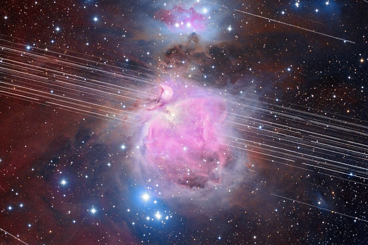 This long-exposure image of the Orion Nebula lasted 208 minutes. In that time, multiple satellite trails streaked across the night sky. Credit: A. H. Abolfath/NOIRLab/NSF/AURA