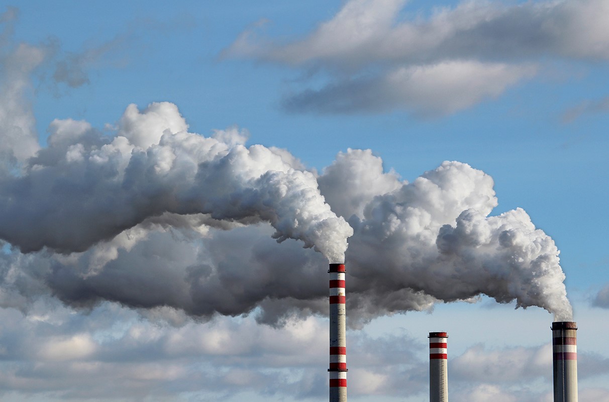 Emissions pour from smokestacks at an industrial plant.