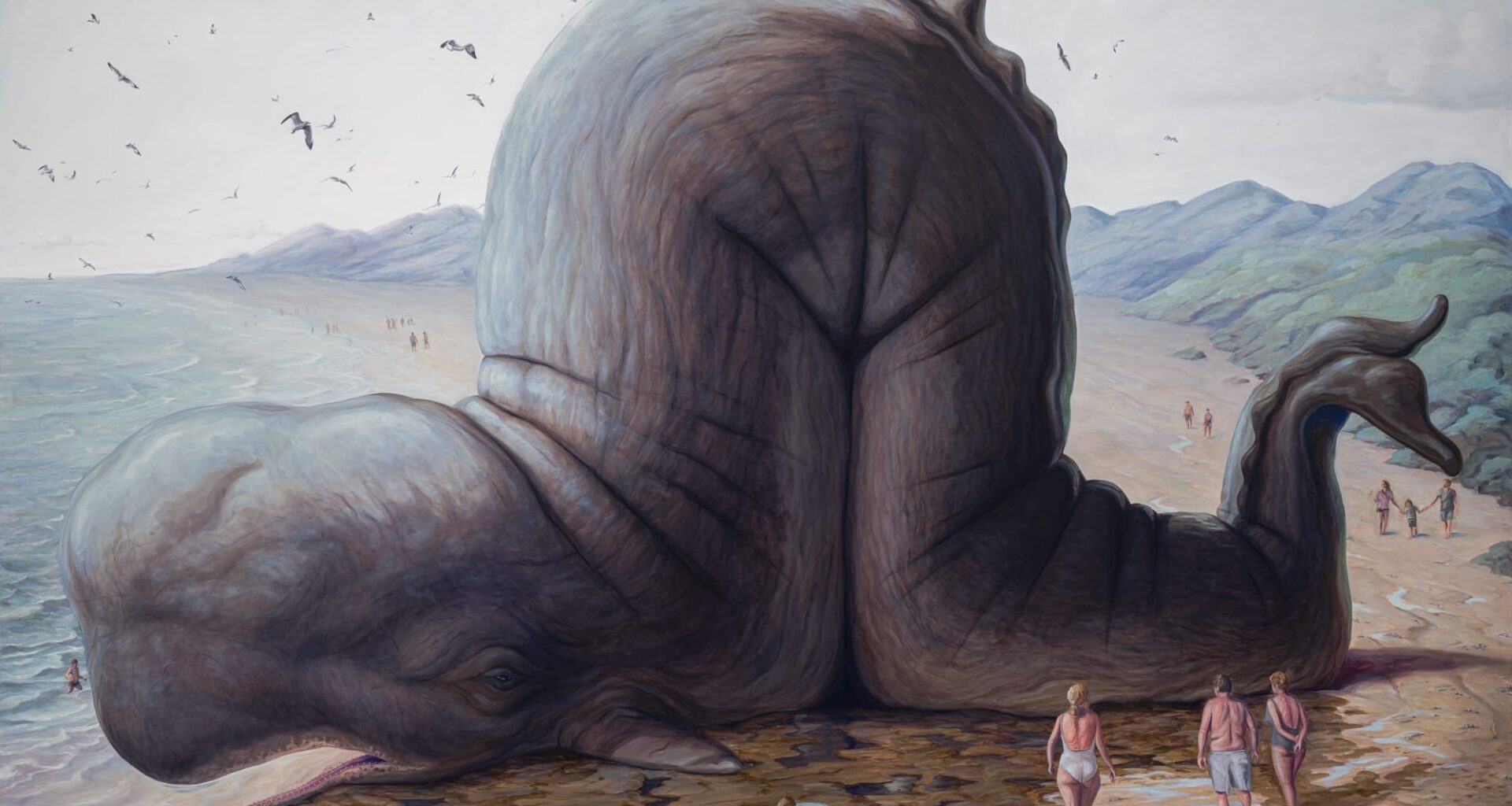 An absurdist painting by Bruno Pontiroli of a giant, scrunched whale on the shore with tiny people looking on.
