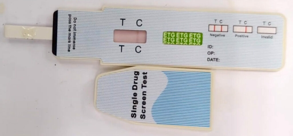 a test strip showing a positive result for alcohol