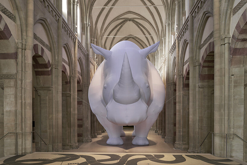 an inflatable rhinoceros occupies the medieval gallery of kunstmuseum magdeburg