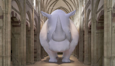 an inflatable rhinoceros occupies the medieval gallery of kunstmuseum magdeburg