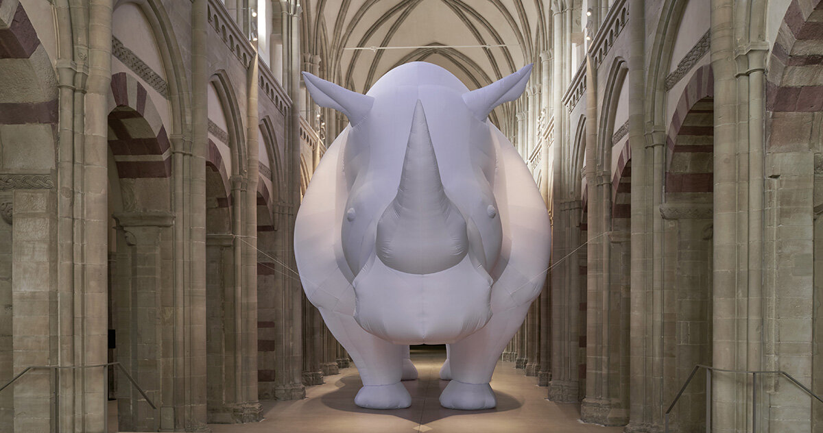 an inflatable rhinoceros occupies the medieval gallery of kunstmuseum magdeburg