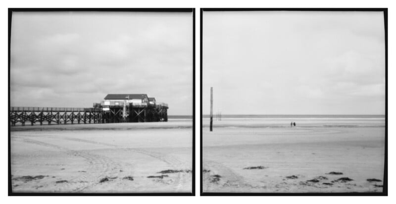 Black and white split-frame photo of a beach. The left side shows a wooden pier with a building on stilts, while the right side displays the sandy shore with two distant people and the sea under a cloudy sky.
