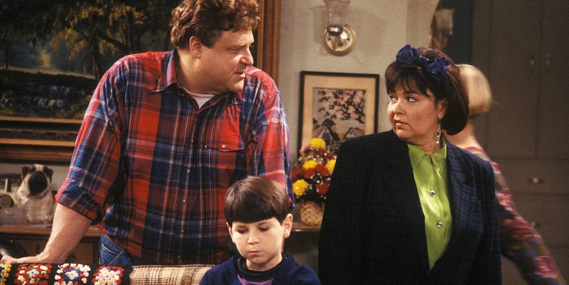 John Goodman, Michael Fishman, and Roseanne Barr in Roseanne.