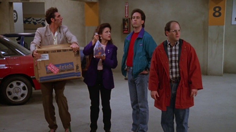 Kramer, Elaine, Jerry, and George standing in a parking garage on Seinfeld S3E6