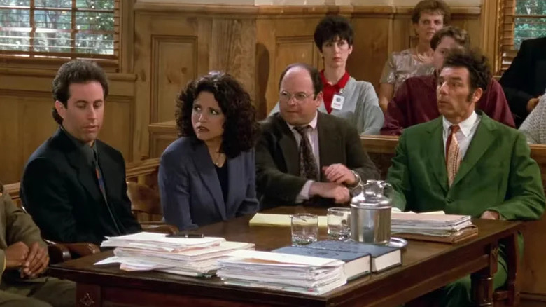 Jerry, Elaine, George, and Kramer sitting in courtroom on Seinfeld