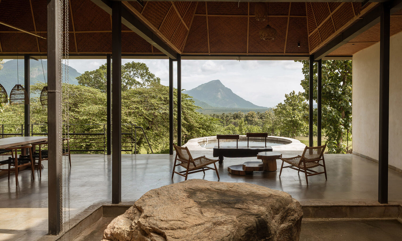Ma+rs designs thatched Serenity retreat as "a quiet observer"
