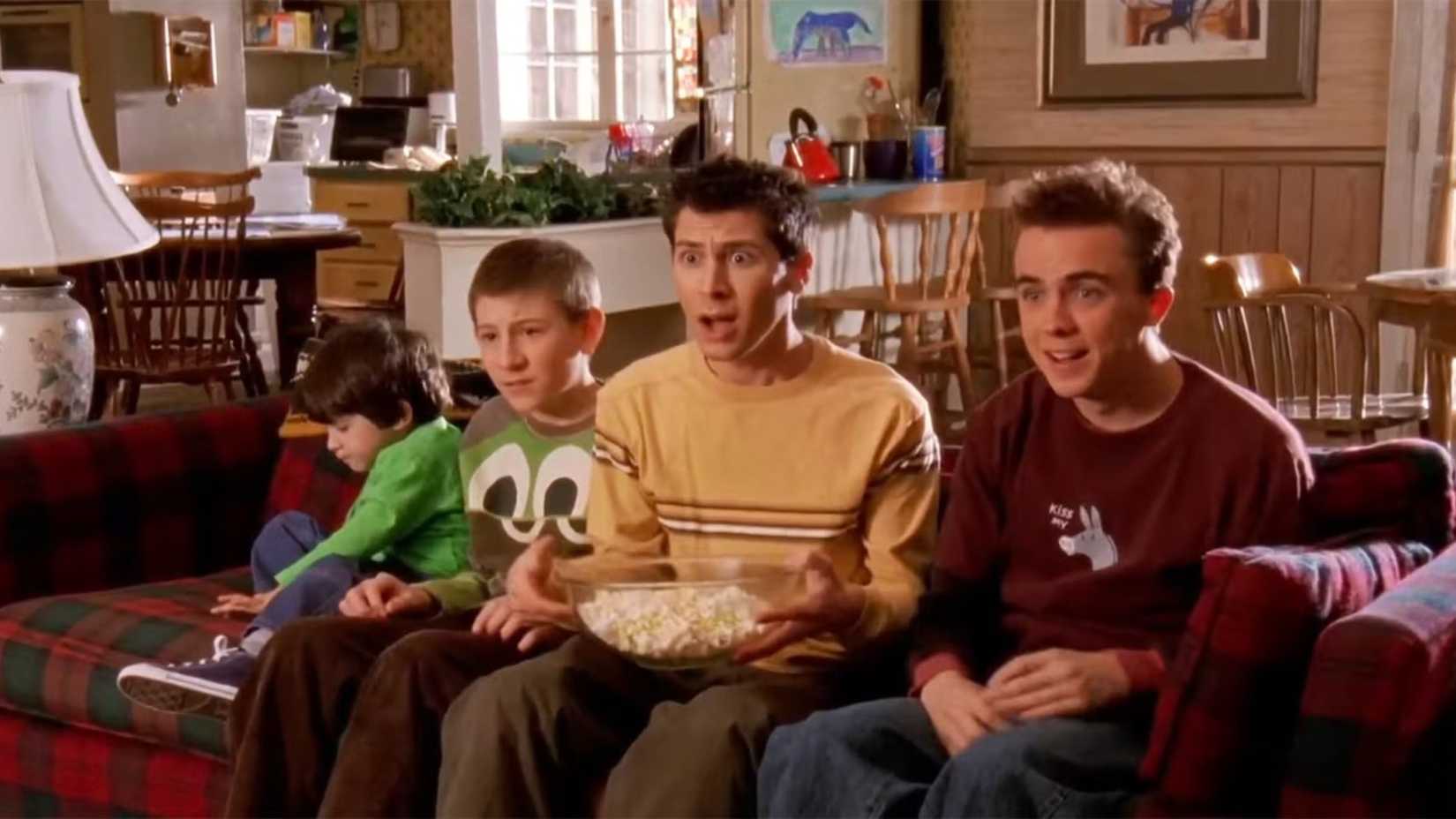 Four children sitting on a sofa in the sitcom Malcolm In The Middle.