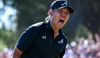 Anthony Kim roars in celebration after sinking his winning putt on the 18th hole