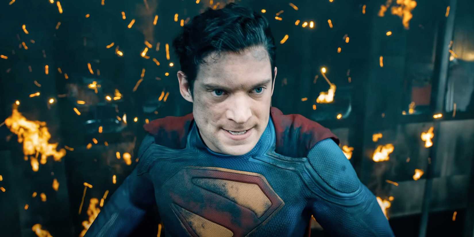 Superman looking angry in front of fire and a building in the DCU Superman movie