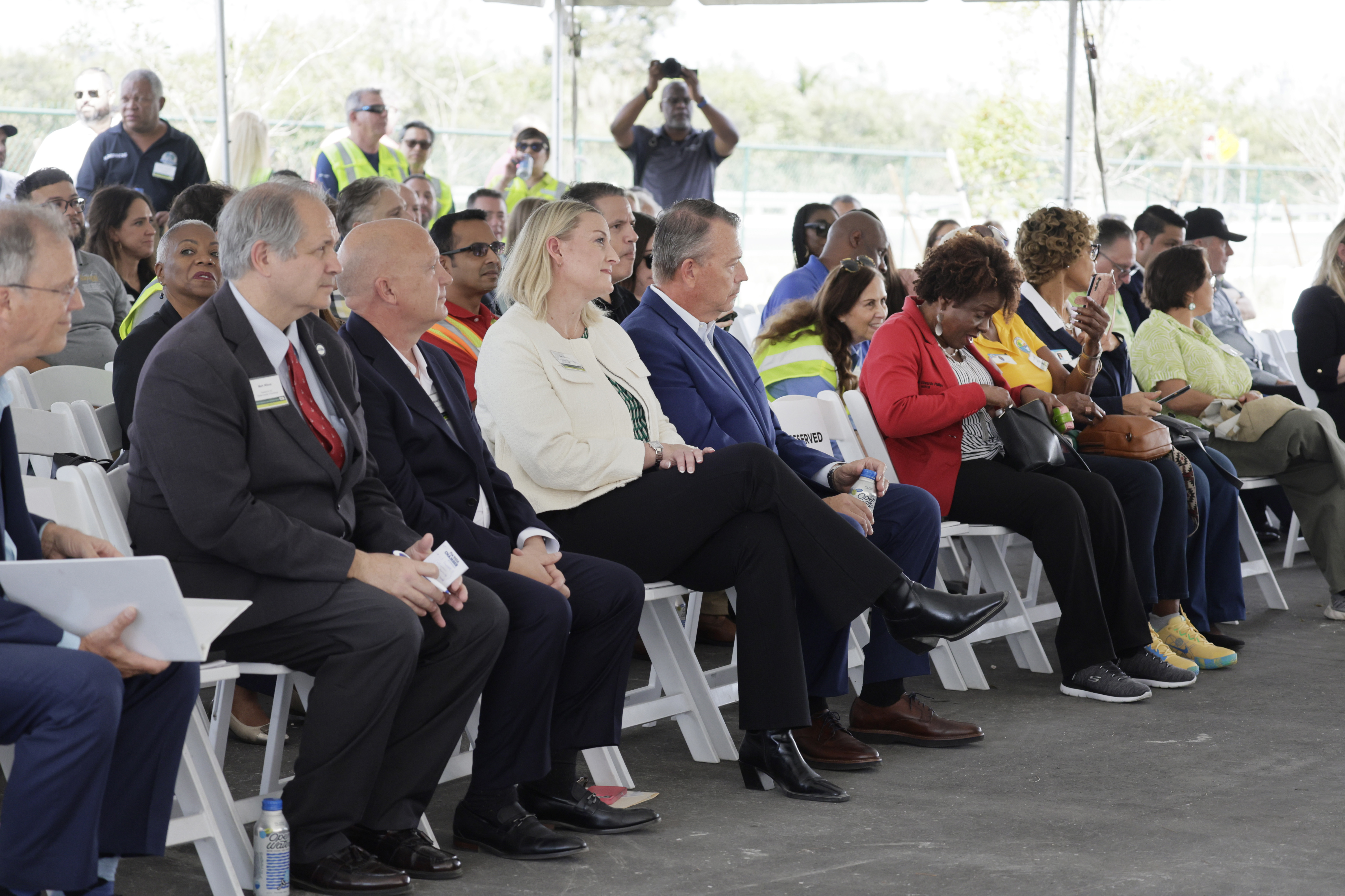 Attendees gather for a ribbon-cutting ceremony at the new Waste...