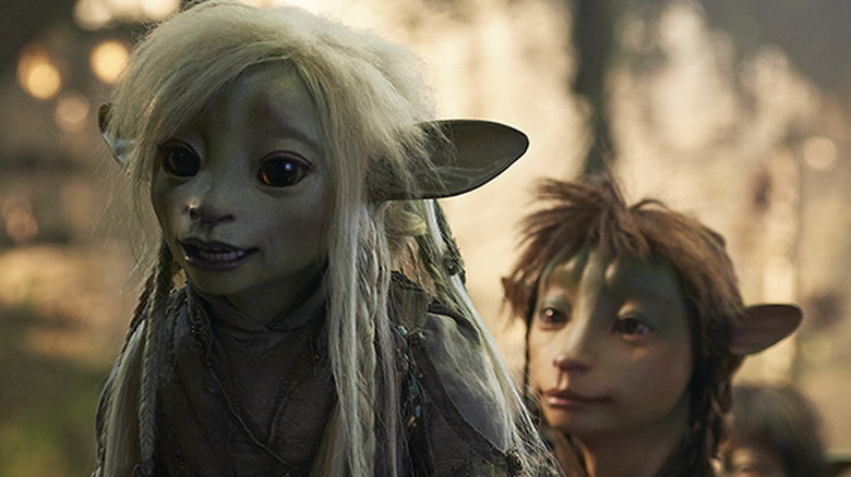 Two puppet characters with big ears and big eyes named Deet and Rian in The Dark Crystal: Age of Resistance