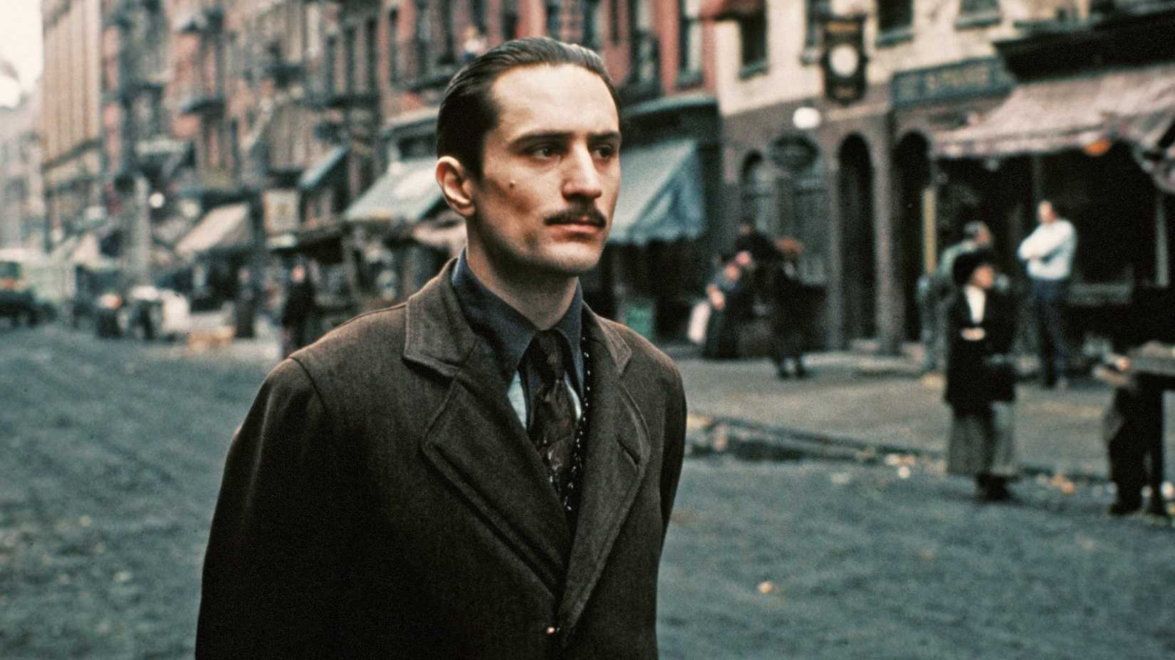 Young Vito stands on the street in Hell's Kitchen in The Godfather Part II