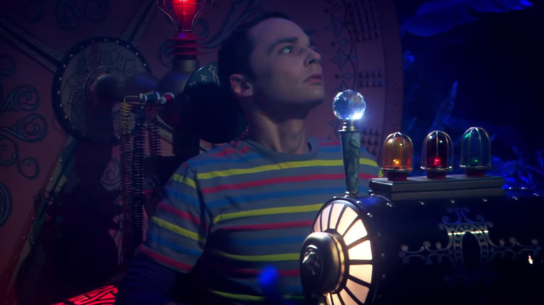 Jim Parsons' Sheldon sitting in the time machine on The Big Bang Theory