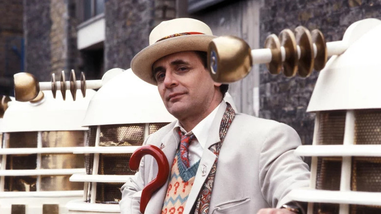 The Seventh Doctor in light suit and hat on Doctor Who